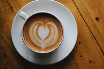 coffee cup on table with beautiful latte art.