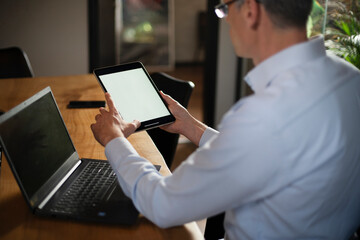 Close up of man using digital tablet