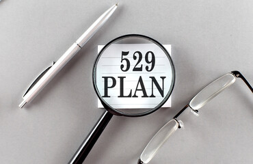 529 PLAN text written on a sticky with pencil and glasses text written on a sticky with pencil and glasses