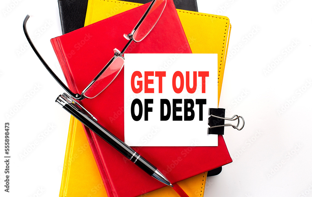 Poster get out of debt text written on a sticky on colorful notebooks