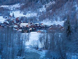 Val d'Herens, Switzerland - April 10th 2022: The historic village of Evolene in the early morning light