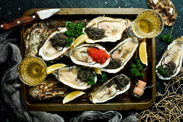 Fototapeta na wymiar White wine, caviar with oysters and lemon ice cream. Healthy food, gourmet food, restaurant food. Top view.