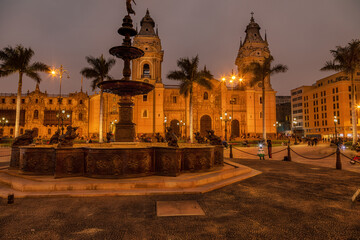 Fototapeta na wymiar The main square - Plaza de Armas - with the Basilica Cathedral and the fountain in Lima, the capital of peru, at night.