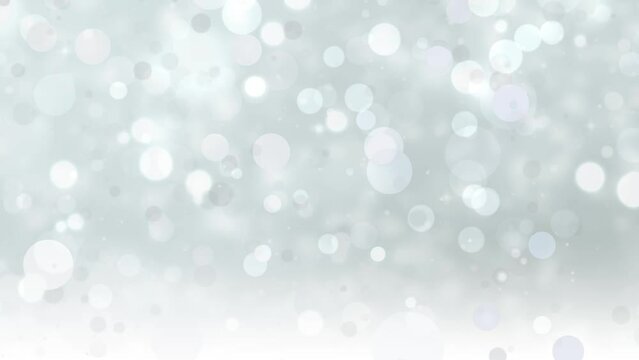 Abstract glitter lights silver background. Seamless looping video footage. (018_Silver)