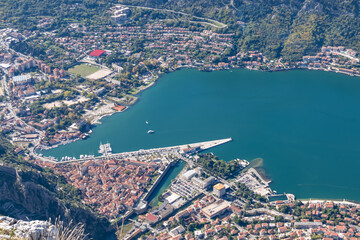 Aerial scenic view from Pestingrad (Derinski Vrh) of Kotor bay, town and harbour on sunny summer, Adriatic Mediterranean Sea, Montenegro, Balkan, Europe. Fjord winding along coastal towns. Lovcen park