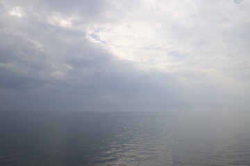 Naklejka na ściany i meble Sea in a cloudy day