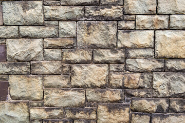 Old dressed stone industrial building wall full frame texture background