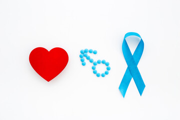 Blue ribbon symbol of prostate cancer with male sign of blue pills