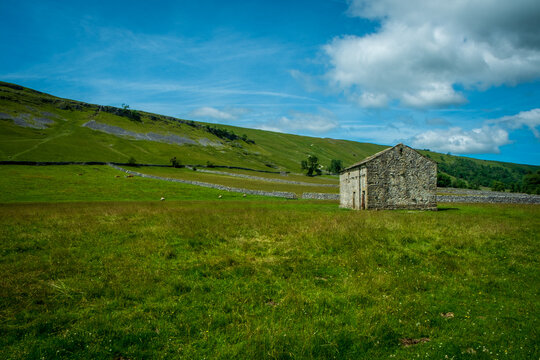Typical drystone walls and barns in the countryside around Kettlewell, Upper Wharfedale, North Yorkshire, UK