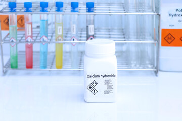 Calcium hydroxide in bottle , chemical in the laboratory and industry