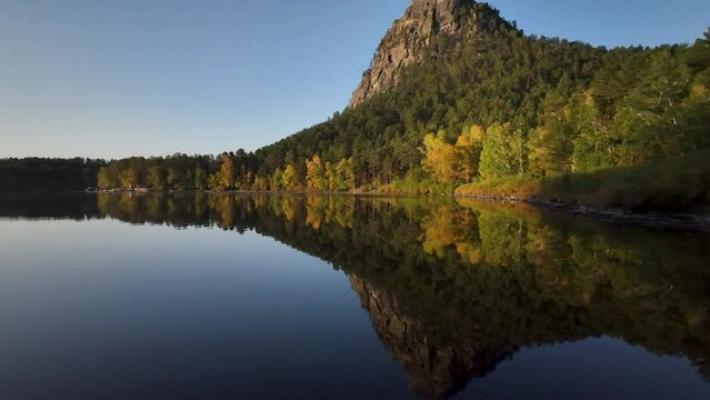 Lake Borovoe and Zhumbaktas cliff. Clear and calm morning in Burabay National Park.