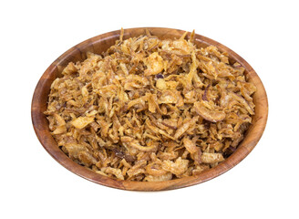 Side view of dried fried onions with salt in a wood bowl isolated on a white background.