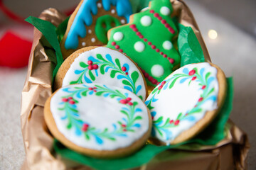 gingerbread cookies painted with colored icing in a box