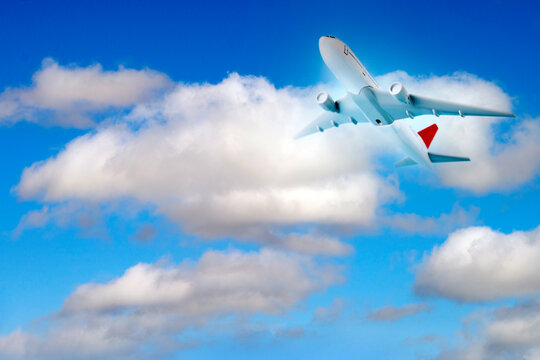 Airplane toy model and sky with clouds