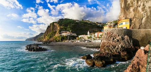 Foto auf Glas Madeira island vacation - picturesque village Ponta do Sol with impressive rocks, nice beach and colorful houses. Portugal © Freesurf