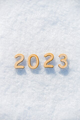 New Year's background-figures 2023 in the snow
