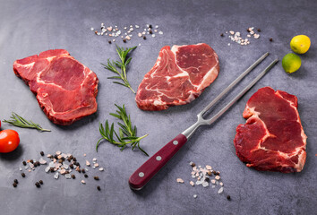 Fresh beef steak on a concrete background