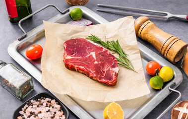 Fresh beef steak on a concrete background