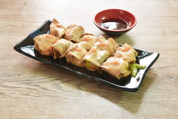 grilled beef dressing mayonnaise topping egg shrimp Sushi Japanese food with wasabi dipping soy sauce on plate