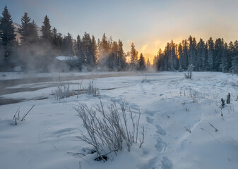 Cold weather ice fog over Spring Creek at Canmore, Alberta, Canada