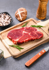 Fresh beef steak on a concrete background