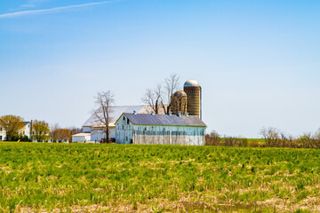 Amish country, farm, home and barn on field agriculture in Lancaster, Pennsylvania, PA US North America