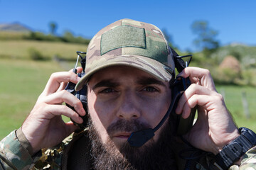 Special operations soldiers team preparing tactical and communication gear for action battle. Long...