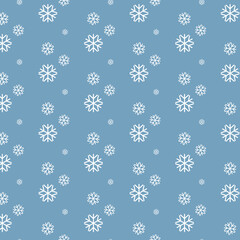 Repeating pattern of snowflakes on a blue background