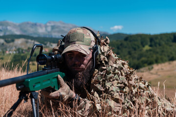 Army soldier holding sniper rifle with scope and aiming in forest. War, army, technology and people...