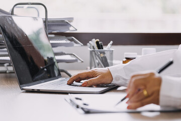 Homecare nursing service and elderly people cardiology healthcare. Close up of young hispanic female doctor nurse check mature caucasian man patient heartbeat using stethoscope during visit