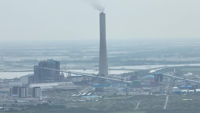 power plant with smoke aerial footage- rampal biddut kendra, dacope, khulna, bangladesh