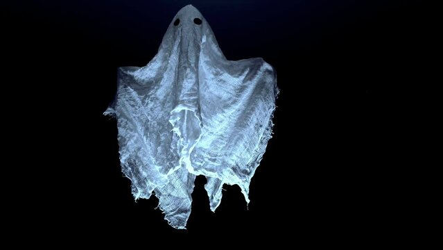 A white ghost hovering near the ceiling at night
