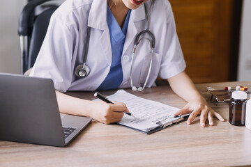 Homecare nursing service and elderly people cardiology healthcare. Close up of young hispanic female doctor nurse check mature caucasian man patient heartbeat using stethoscope during visit