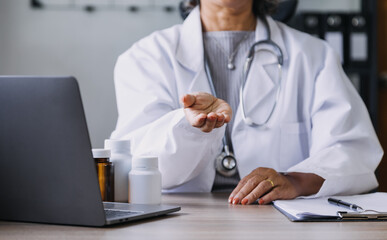 Homecare nursing service and elderly people cardiology healthcare. Close up of young hispanic female doctor nurse check mature caucasian man patient heartbeat using stethoscope during visit