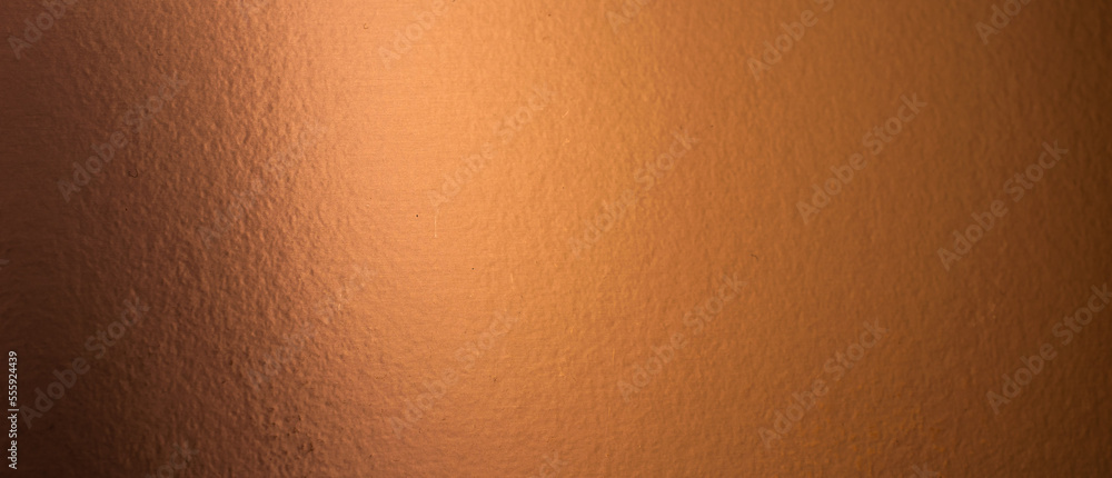 Wall mural sheet metal painted a copper color. background or texture