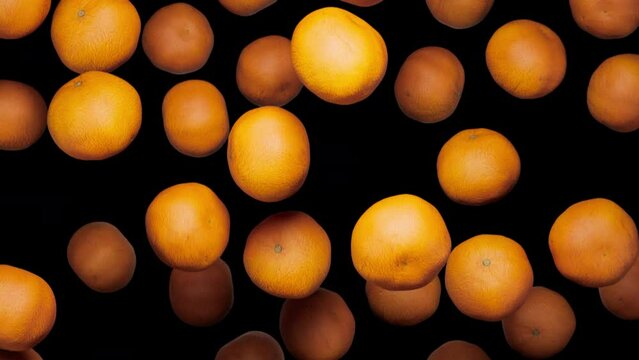 Looping animation of clementine oranges falling on an alpha transparent background.