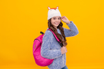 express positive emotion. winter fashion. positive kid with curly hair in hat. back to school.