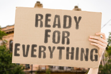 The phrase " Ready for Anything " is on a banner in men's hands with blurred background. Effort. Decision. Solution. Persistence. Idea. Working. Resolution. Difficulty. Difficult. Planning. Economy