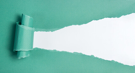 Torn sheet of green paper with copy space on white background