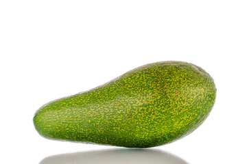 One ripe avocado, macro, isolated on white background.