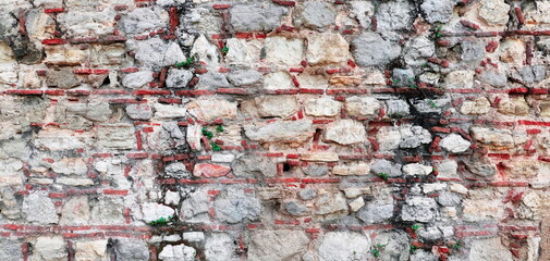 Empty Old Weathered Brick Wall Texture. Grungy Brickwork. Shabby Building Façade with Damaged Plaster. Copy Space. Place for text