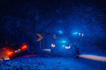 The roadside assistance service pulling the car out of the canal. An incident on a frozen Scandinavian road.