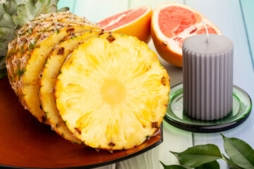 sliced pineapple on wood background