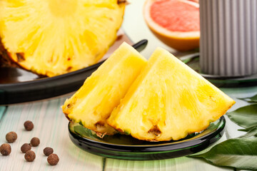 sliced pineapple on wood background