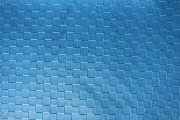 Textured Blue background of Checks embossed chart paper. Emboss checkered pattern of Glossy handmade paper
