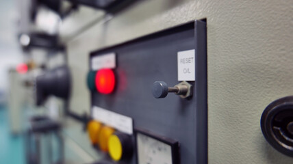 Electric control cabinet with control buttons and lamps indicating the various operating status installed in the electric control room. Operational concepts, energy, energy, technology and industrial