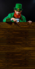 Leprechaun elf on St. Patrick's Day. Cheerful character Irish leprechaun for advertising with a red...