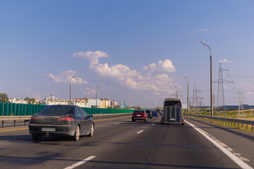 Highway wide road, transport and blue sky with clouds on a summer day