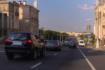 Highway wide road in the city, transport and blue sky with clouds on a summer day