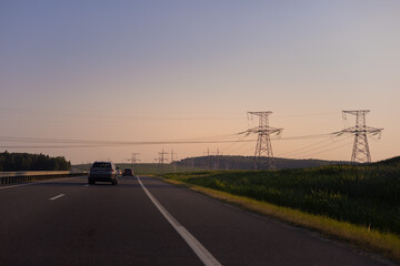 Evening view at sunset. Highway road in the countryside, roadside and asphalt